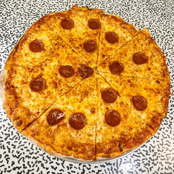 A whole pepperoni pizza from Italo pizza and kosher kitchen, sliced into eight pieces.